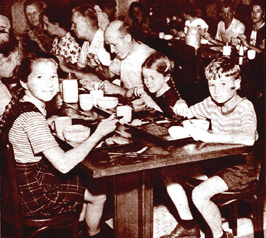 German internee family eating a meal in a dining hall at Crystal City alien internment