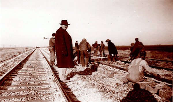 Internees of Fort Lincoln alien internment camp in North Dakota, working under guard for the Northern Pacific Railroad replacing rails