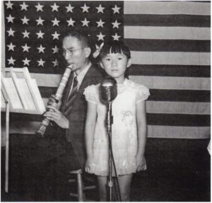 Shakuhachi Player and a young girl, Jul. 1945, Topaz concentration camp, Utah.